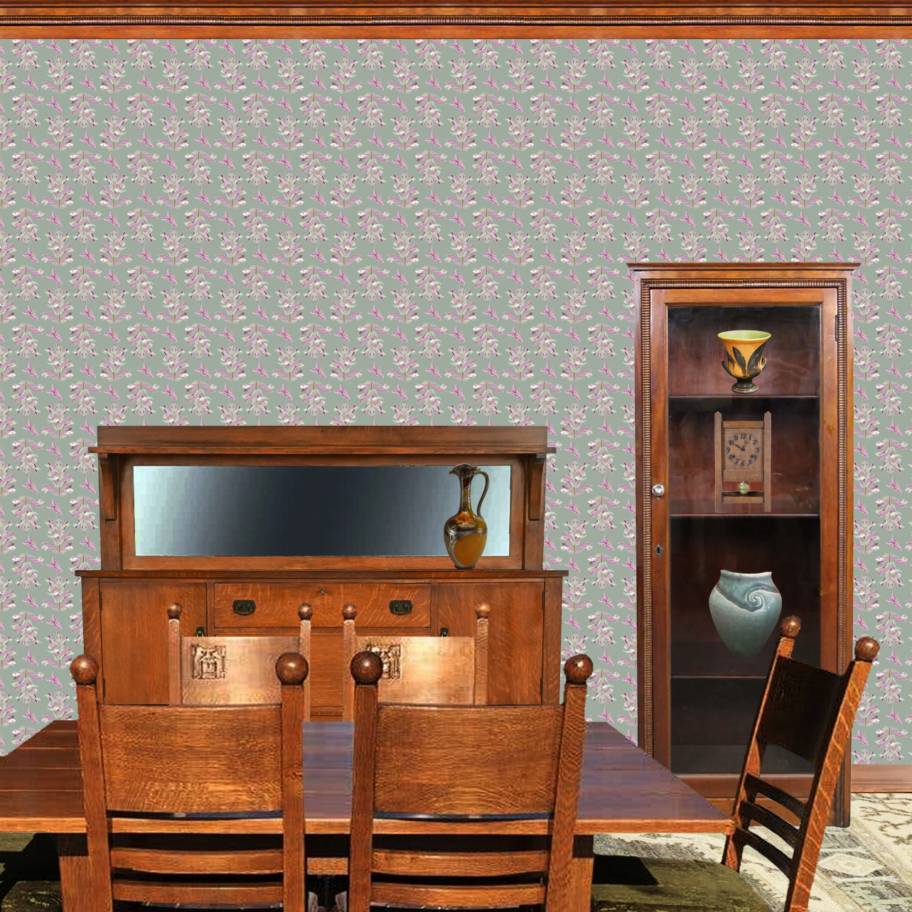 The artwork features a repeating pattern of large, stylized flowers and leaves in shades of pink and lavender against a rich sage background. The flowers have elongated petals and leaves with intricate vein details, while the butterflies exhibit delicate wing shapes with matching color tones. Soft white floral accents complement the design, creating a harmonious and elegant botanical motif. The wallpaper design is shown in a Mission style dining room.