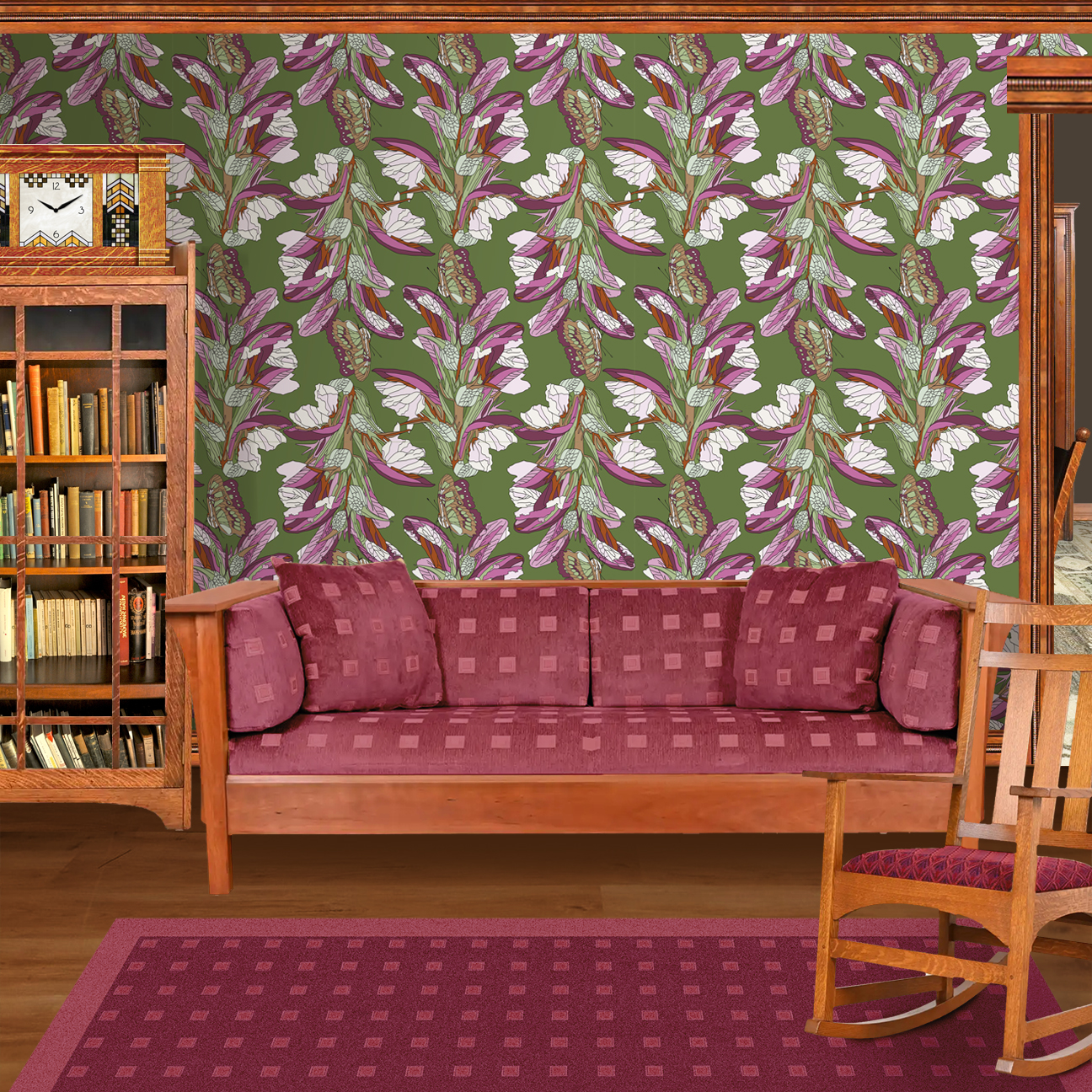 The artwork is a detailed, stylized pattern featuring butterflies and flowers. The background is an olive green color that contrasts with the dominant purples, pinks, and whites of the flowers. The flowers have elongated petals with intricate vein details, while the butterflies display delicate, patterned wings in shades of brown, pink, and beige. The composition is repeated seamlessly, creating a harmonious and balanced design with a natural, botanical theme. The wallpaper design is shown in a Mission style living room