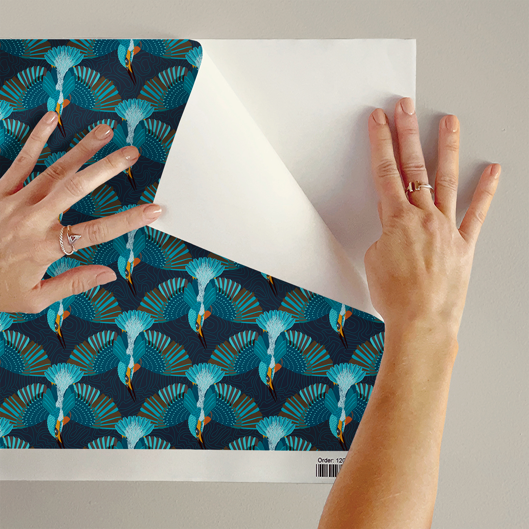 The artwork is a repeating pattern featuring stylized kingfisher birds illustrated in vibrant shades of blue, teal, and orange. Each bird is depicted in a dynamic pose, diving downward with wings fully spread and tail feathers fanned out. The background is dark navy with subtle, curving contour-like lines that add depth and texture without distracting from the birds. The overall composition creates an energetic and harmonious rhythm through the repetition of the detailed, geometric plumage and the crisp outlines, capturing the essence of motion and nature with a modern graphic design approach.