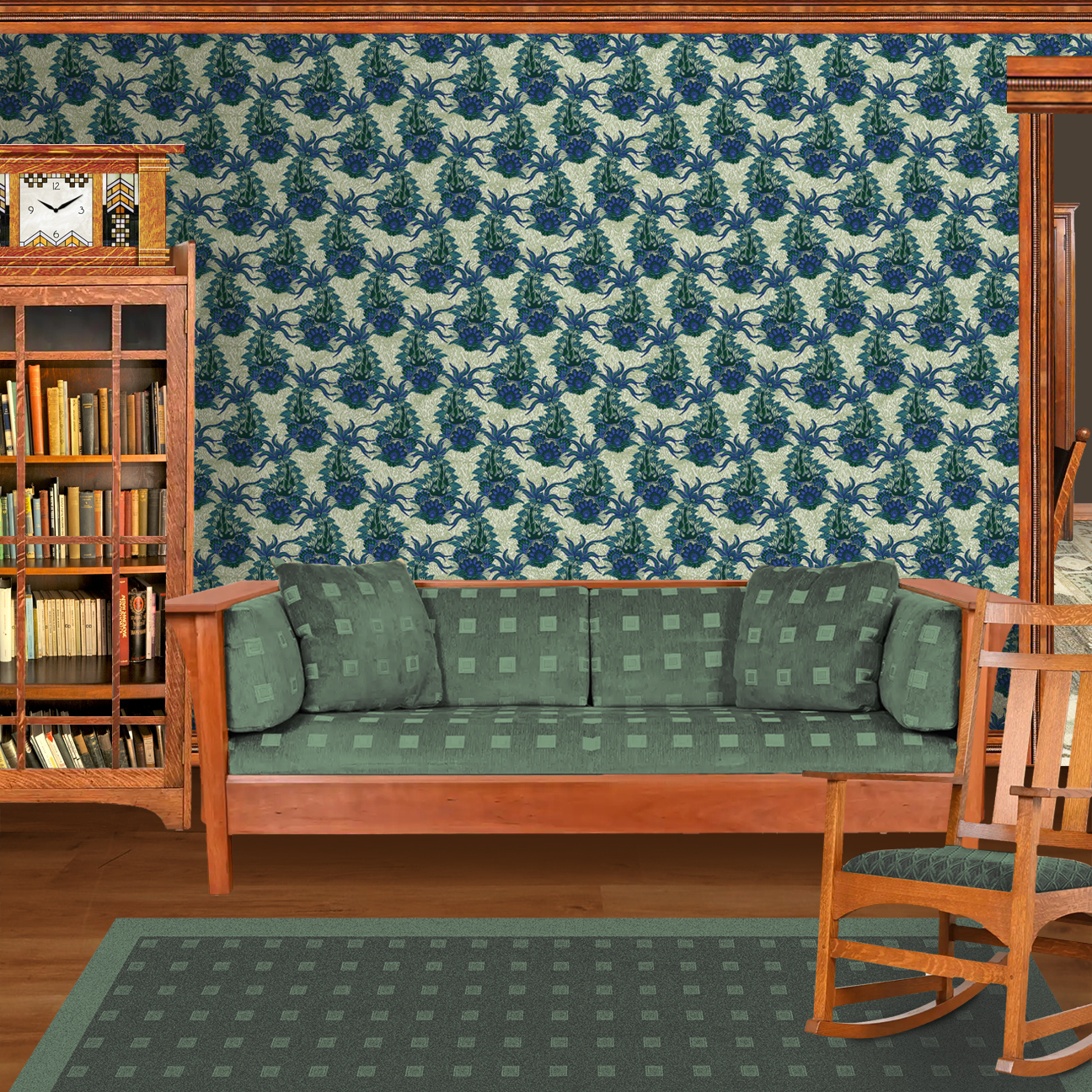 The artwork is a textile design featuring an intricate floral pattern. It showcases large, stylized flowers primarily in shades of blue and green. The flowers have detailed petals with layered, petal-like shapes creating a sense of depth and richness. Interwoven with the flowers are long, curved leaves and stems, adding dynamic movement to the composition. The background consists of a muted, light beige area patterned with subtle, organic shapes that resemble small leaves or plant forms, providing texture without overwhelming the main floral elements. The wallpaper design is shown in a Mission style living room