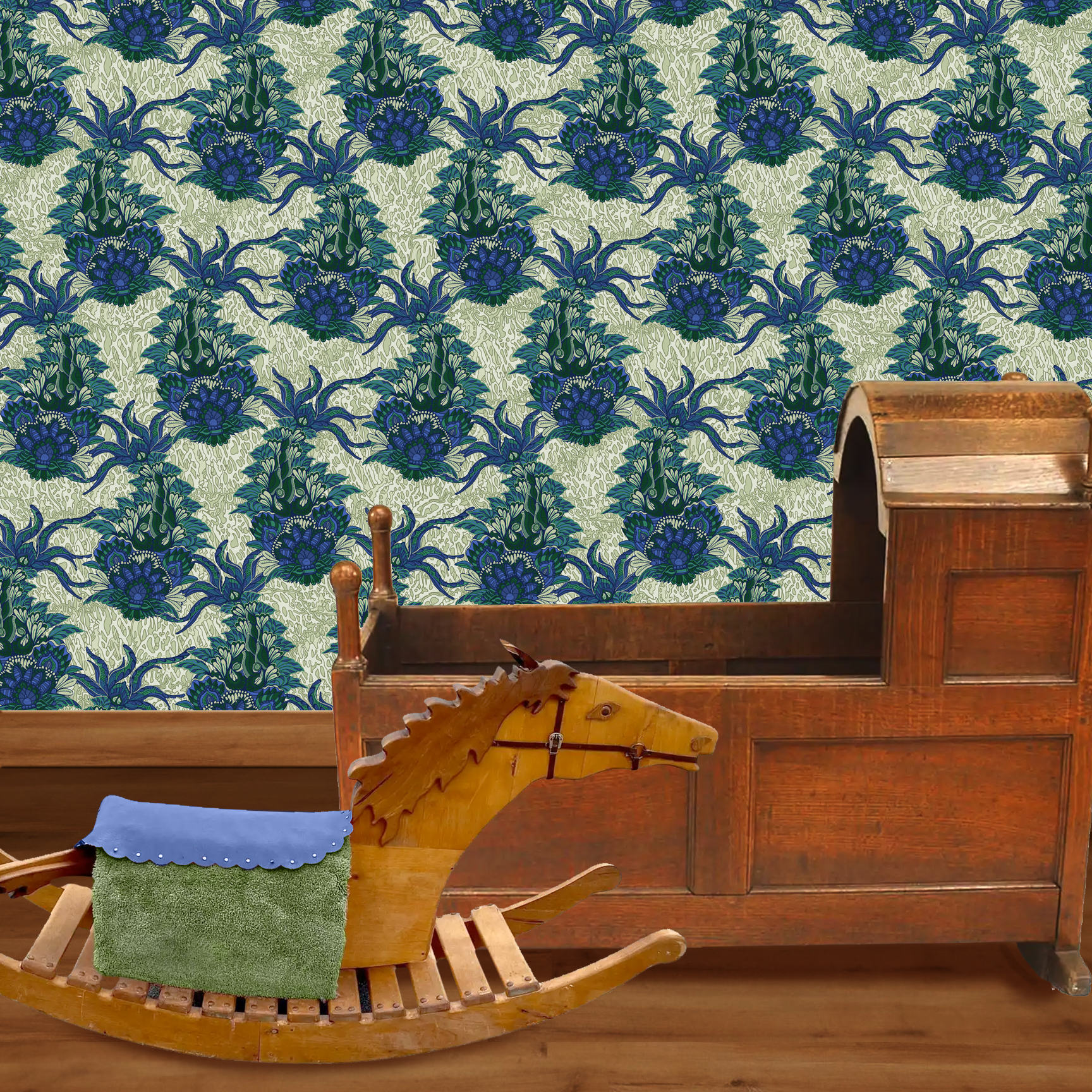 The artwork is a textile design featuring an intricate floral pattern. It showcases large, stylized flowers primarily in shades of blue and green. The flowers have detailed petals with layered, petal-like shapes creating a sense of depth and richness. Interwoven with the flowers are long, curved leaves and stems, adding dynamic movement to the composition. The background consists of a muted, light beige area patterned with subtle, organic shapes that resemble small leaves or plant forms, providing texture without overwhelming the main floral elements. The wallpaper design is shown in a Mission style nursery.