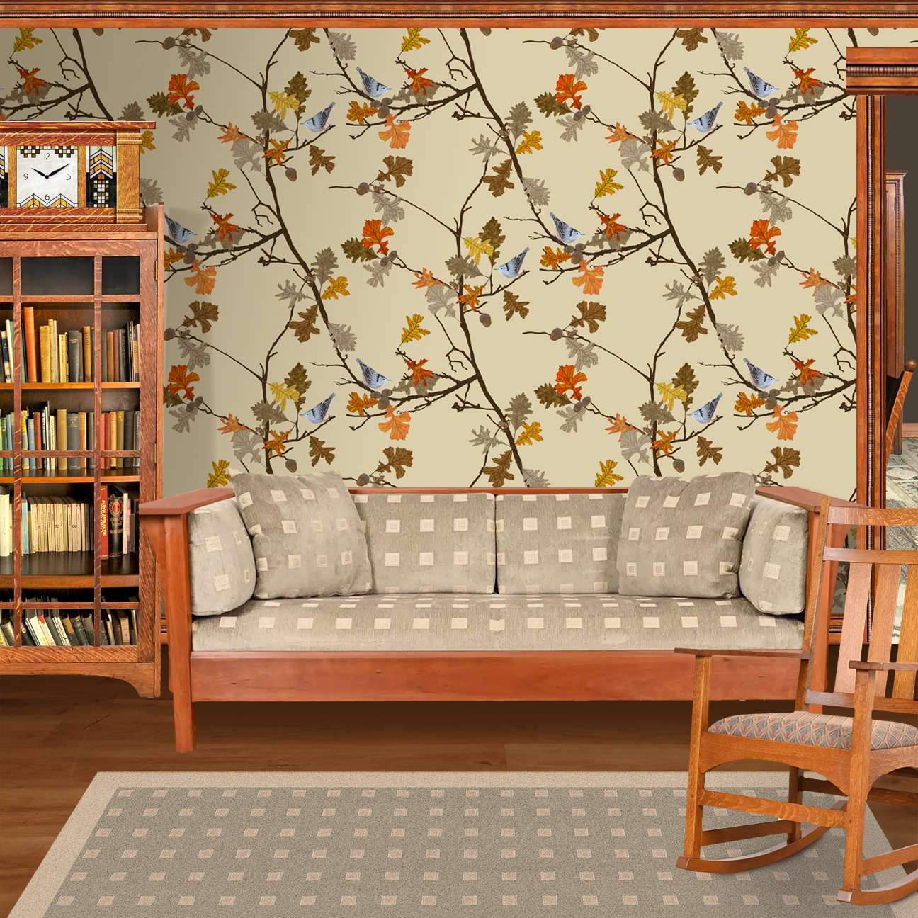 The artwork consists of delicate autumn branches adorned with detailed oak leaves in various shades of orange, yellow, brown, and tan. The branches intertwine gracefully against a solid beige background, creating an elegant and natural composition. Two small nuthatch birds with intricate black-and-white plumage are perched among the leaves, adding a subtle contrast and a lively element to the piece. Tree frogs are nestled in the joining twigs. The overall style is refined and decorative, highlighting the beauty of fall foliage and wildlife. The wallpaper design is shown in a Mission style living room