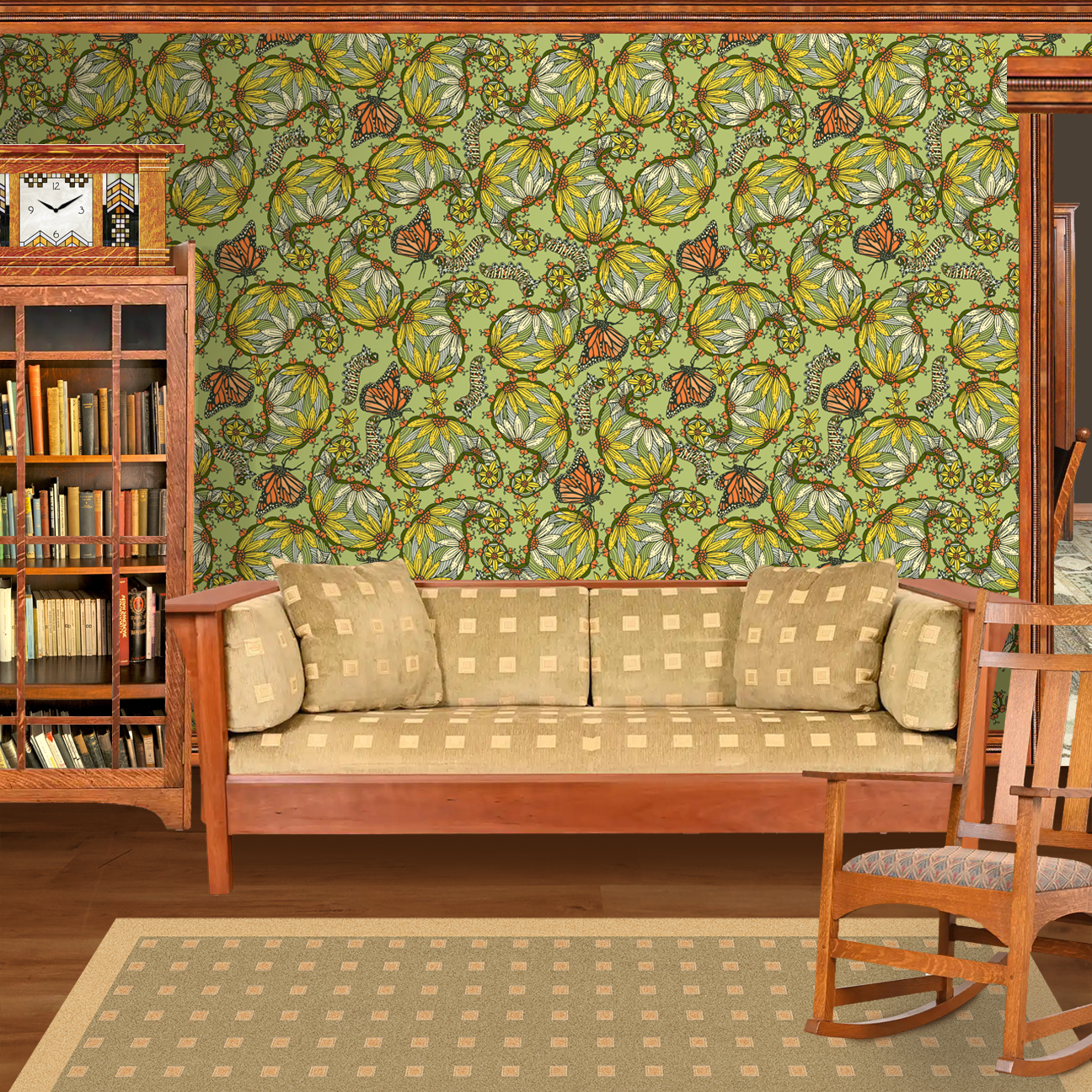 The artwork features a dense, seamless pattern composed of intricately detailed butterflies, caterpillars, and flowers. The butterflies are primarily orange with black and white accents, conveying a monarch butterfly design. The caterpillars are segmented and textured with earthy tones of green and beige, blending naturally with the floral elements. The flowers have petals colored in shades of pale pink and green, with leaves interspersed throughout the composition. The background is a light, muted yellow, which enhances the vibrant colors of the butterflies and floral motifs. The overall design is highly decorative and organic, showcasing a lyrical interplay between the stages of a butterfly's life cycle and plant life. The wallpaper design is shown in a Mission style living room
