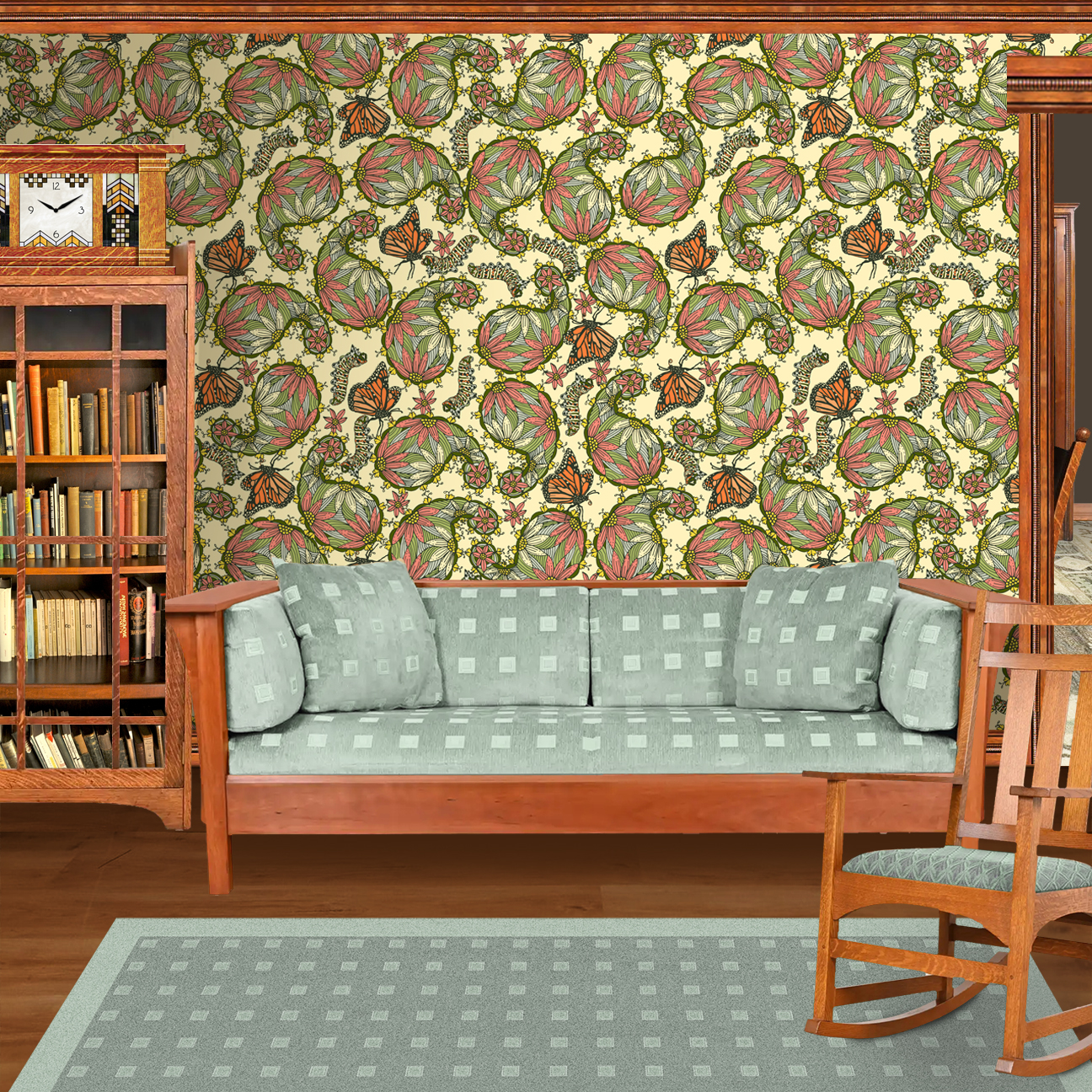 The artwork features a dense, seamless pattern composed of intricately detailed butterflies, caterpillars, and flowers. The butterflies are primarily orange with black and white accents, conveying a monarch butterfly design. The caterpillars are segmented and textured with earthy tones of green and beige, blending naturally with the floral elements. The flowers have petals colored in shades of pale pink and green, with leaves interspersed throughout the composition. The background is a light, muted yellow, which enhances the vibrant colors of the butterflies and floral motifs. The overall design is highly decorative and organic, showcasing a lyrical interplay between the stages of a butterfly's life cycle and plant life. The wallpaper design is shown in a Mission style living room