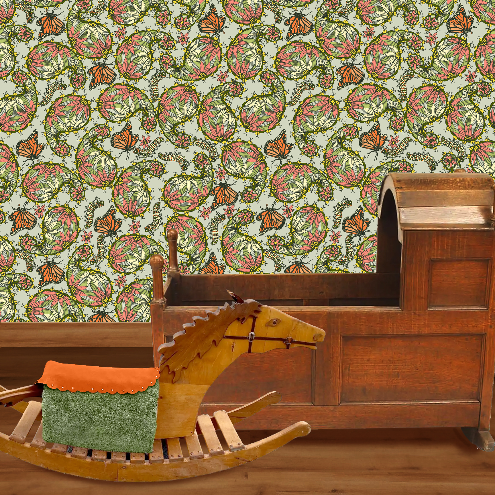 The artwork features a dense, seamless pattern composed of intricately detailed butterflies, caterpillars, and flowers. The butterflies are primarily orange with black and white accents, conveying a monarch butterfly design. The caterpillars are segmented and textured with earthy tones of green and beige, blending naturally with the floral elements. The flowers have petals colored in shades of pale pink and green, with leaves interspersed throughout the composition. The background is a light, muted yellow, which enhances the vibrant colors of the butterflies and floral motifs. The overall design is highly decorative and organic, showcasing a lyrical interplay between the stages of a butterfly's life cycle and plant life. The wallpaper design is shown in a Mission style nursery.