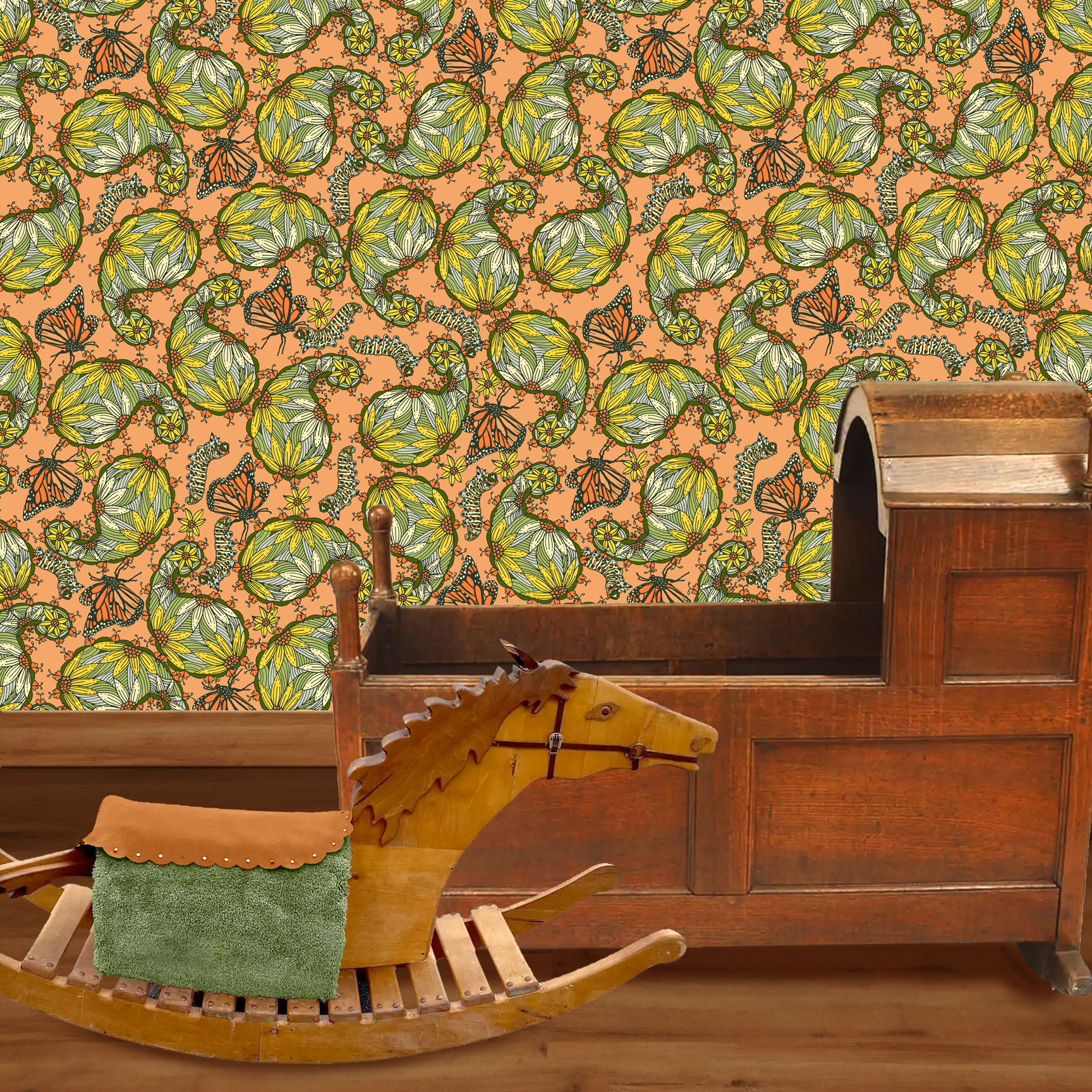 The artwork features a dense, seamless pattern composed of intricately detailed butterflies, caterpillars, and flowers. The butterflies are primarily orange with black and white accents, conveying a monarch butterfly design. The caterpillars are segmented and textured with earthy tones of green and beige, blending naturally with the floral elements. The flowers have petals colored in shades of pale pink and green, with leaves interspersed throughout the composition. The background is a light, muted yellow, which enhances the vibrant colors of the butterflies and floral motifs. The overall design is highly decorative and organic, showcasing a lyrical interplay between the stages of a butterfly's life cycle and plant life. The wallpaper design is shown in a Mission style nursery.