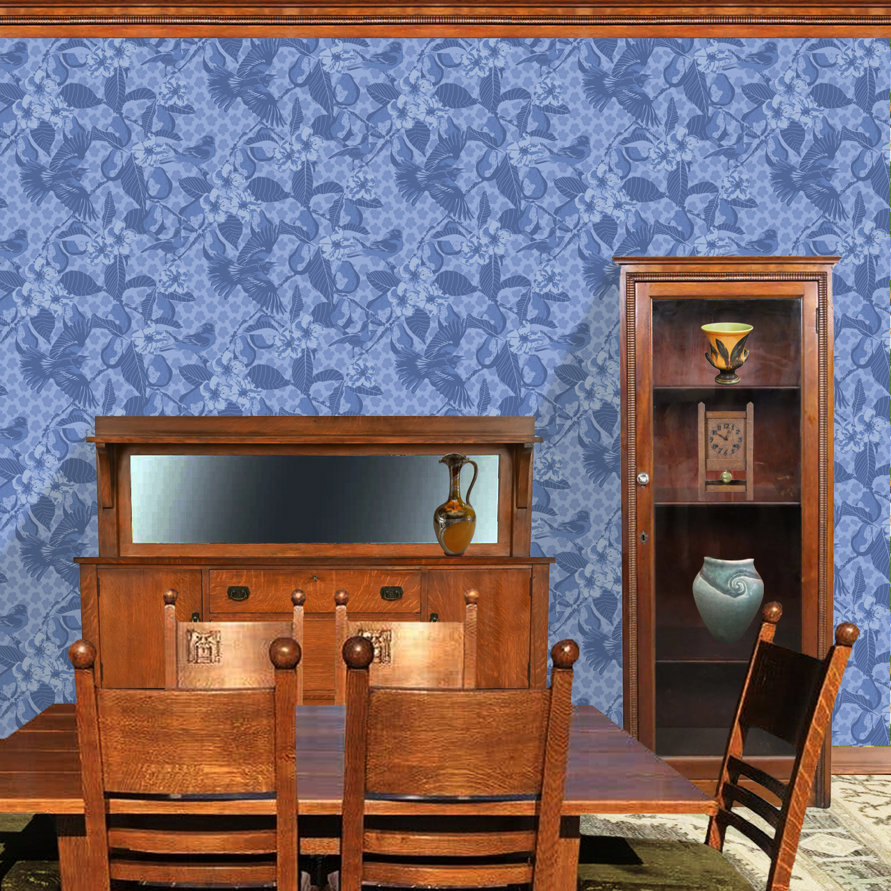 The artwork showcases a vibrant and detailed pattern featuring three orange and black birds set against a backdrop of yellow pears, green leaves, and white blossoms. The birds are depicted in different poses: one perched on a branch, one in mid-flight with wings spread, and another near a pear. The rich colors and intricate details of the feathers, fruits, and flowers create a lively and harmonious composition. The overall style combines naturalistic elements with a decorative, repeating design, highlighting the beauty of nature with emphasis on bold contrasts and vivid hues. The wallpaper design is shown in a Mission style dining room.