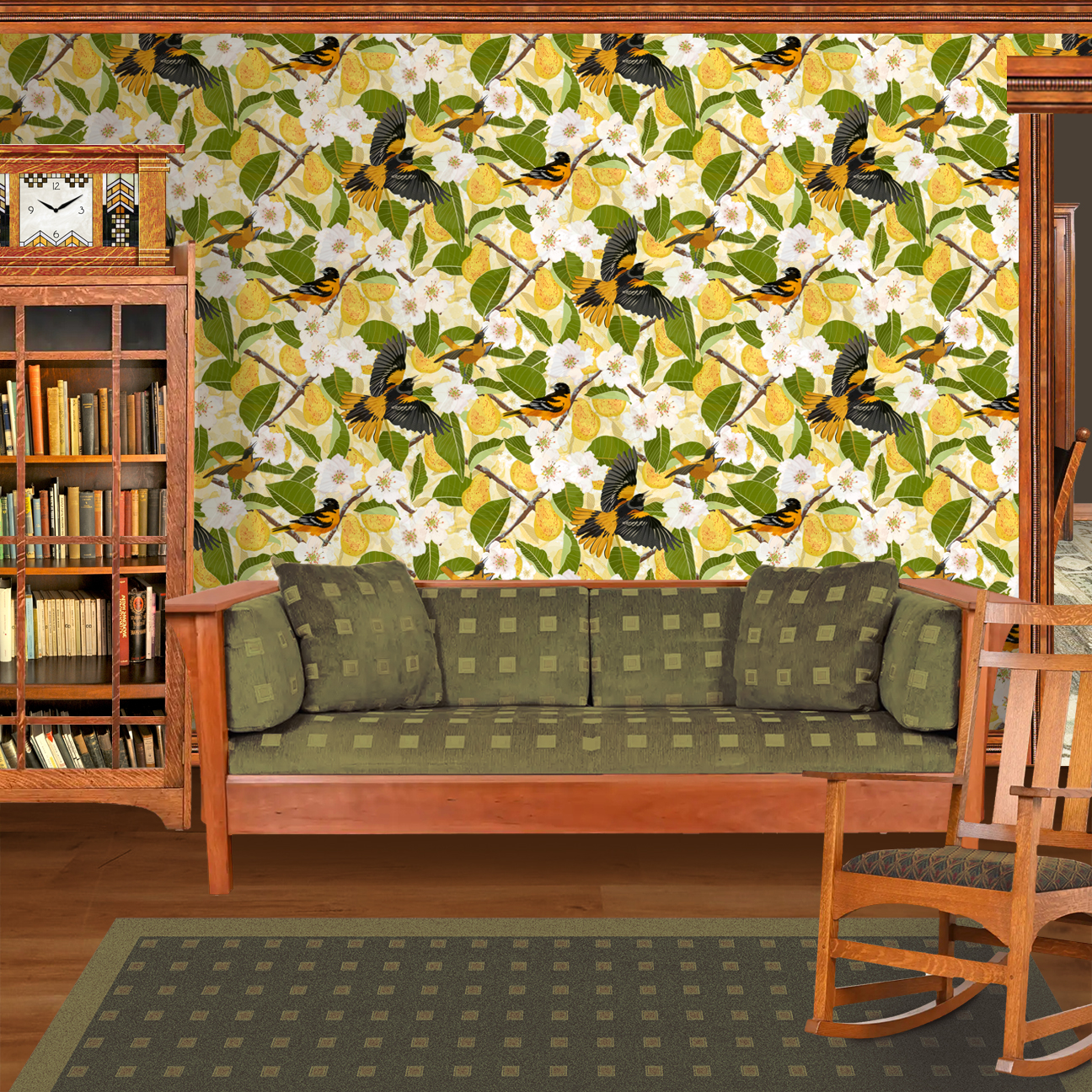 The artwork showcases a vibrant and detailed pattern featuring three orange and black birds set against a backdrop of yellow pears, green leaves, and white blossoms. The birds are depicted in different poses: one perched on a branch, one in mid-flight with wings spread, and another near a pear. The rich colors and intricate details of the feathers, fruits, and flowers create a lively and harmonious composition. The overall style combines naturalistic elements with a decorative, repeating design, highlighting the beauty of nature with emphasis on bold contrasts and vivid hues. The wallpaper design is shown in a Mission style living room