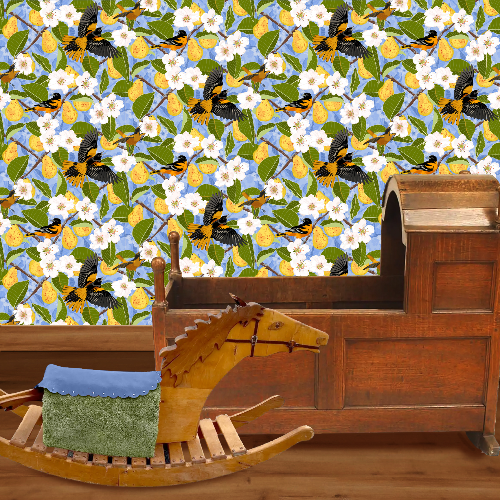 The artwork showcases a vibrant and detailed pattern featuring three orange and black birds set against a backdrop of yellow pears, green leaves, and white blossoms. The birds are depicted in different poses: one perched on a branch, one in mid-flight with wings spread, and another near a pear. The rich colors and intricate details of the feathers, fruits, and flowers create a lively and harmonious composition. The overall style combines naturalistic elements with a decorative, repeating design, highlighting the beauty of nature with emphasis on bold contrasts and vivid hues. The wallpaper design is shown in a Mission style nursery.