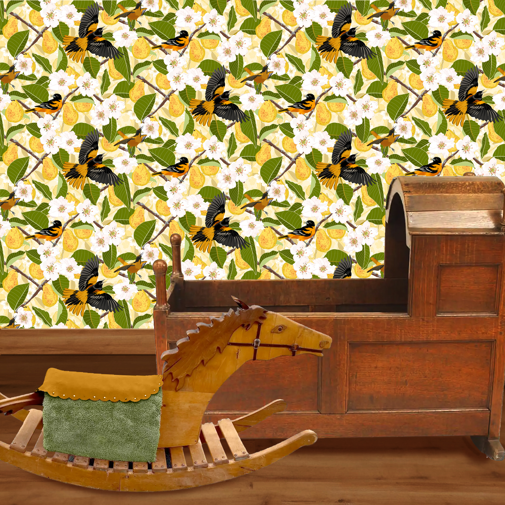 The artwork showcases a vibrant and detailed pattern featuring three orange and black birds set against a backdrop of yellow pears, green leaves, and white blossoms. The birds are depicted in different poses: one perched on a branch, one in mid-flight with wings spread, and another near a pear. The rich colors and intricate details of the feathers, fruits, and flowers create a lively and harmonious composition. The overall style combines naturalistic elements with a decorative, repeating design, highlighting the beauty of nature with emphasis on bold contrasts and vivid hues. The wallpaper design is shown in a Mission style nursery.