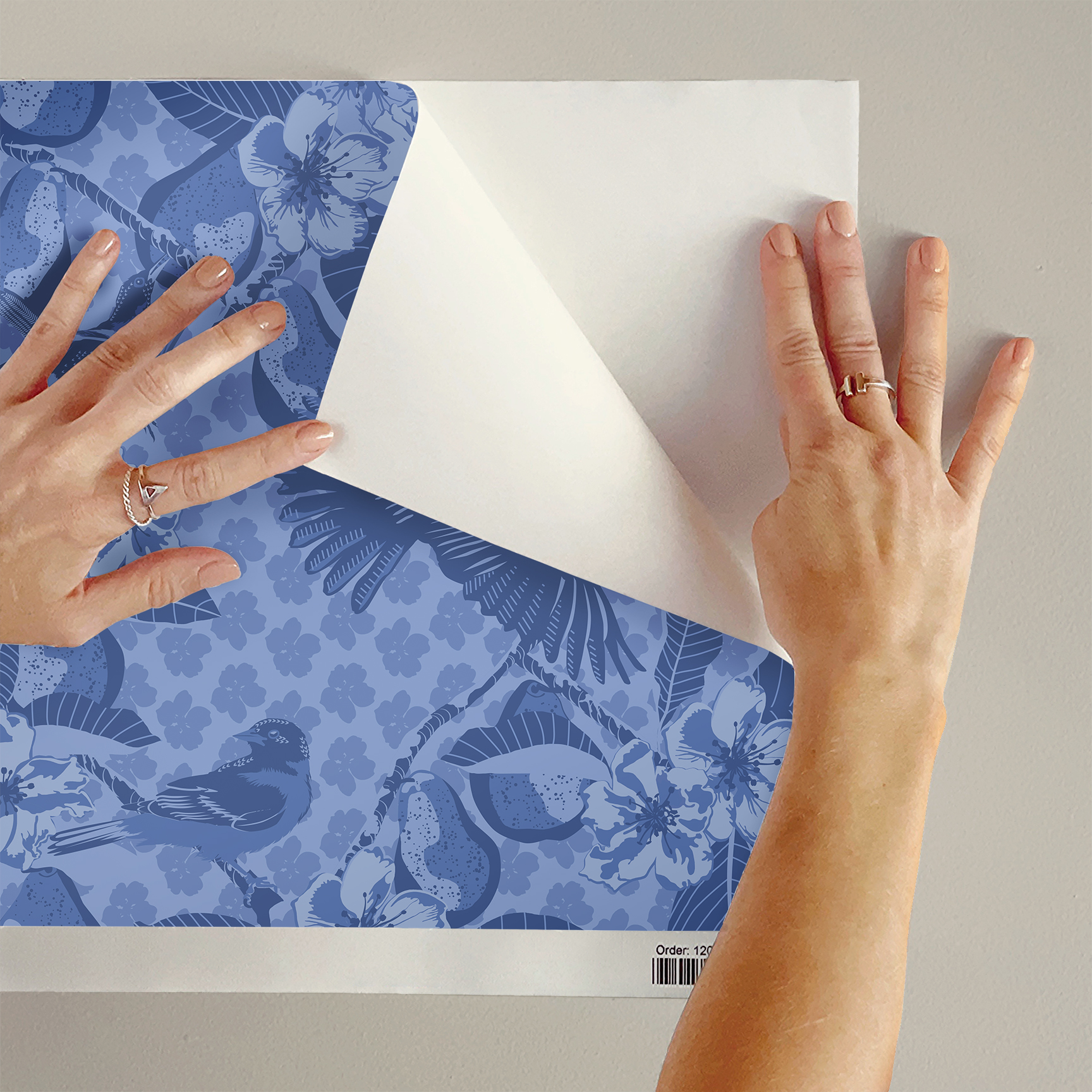 The artwork showcases a vibrant and detailed pattern featuring three orange and black birds set against a backdrop of yellow pears, green leaves, and white blossoms. The birds are depicted in different poses: one perched on a branch, one in mid-flight with wings spread, and another near a pear. The rich colors and intricate details of the feathers, fruits, and flowers create a lively and harmonious composition. The overall style combines naturalistic elements with a decorative, repeating design, highlighting the beauty of nature with emphasis on bold contrasts and vivid hues.