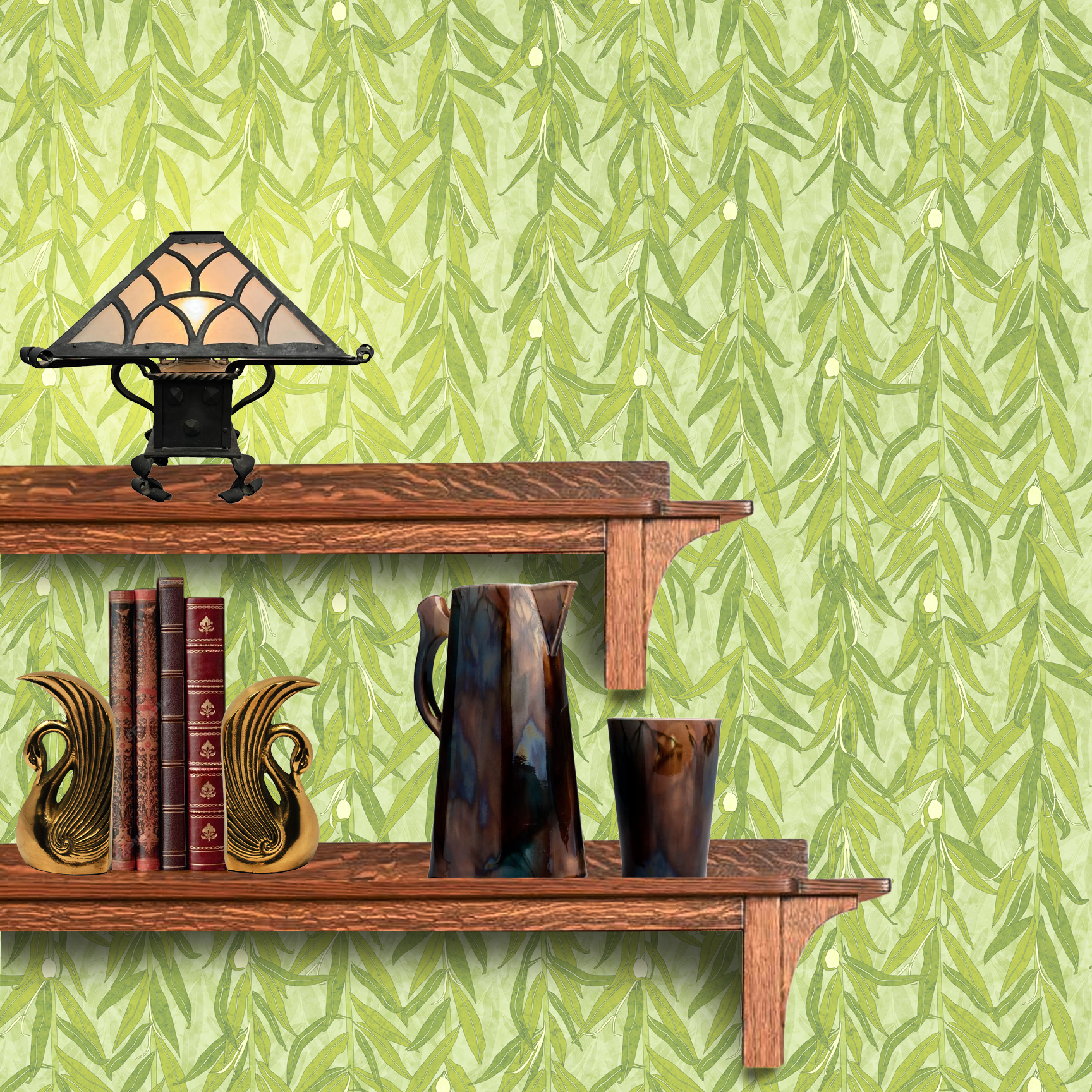 The artwork is a repeating pattern of olive branches with slender green leaves and small, light yellow-green olives set against a pale textured background. The branches hang vertically, creating a cascading effect. The color palette is composed of various shades of green and soft yellow tones, giving the piece a natural, calming, and organic feel. The wallpaper design is shown behind a Mission style shelf.