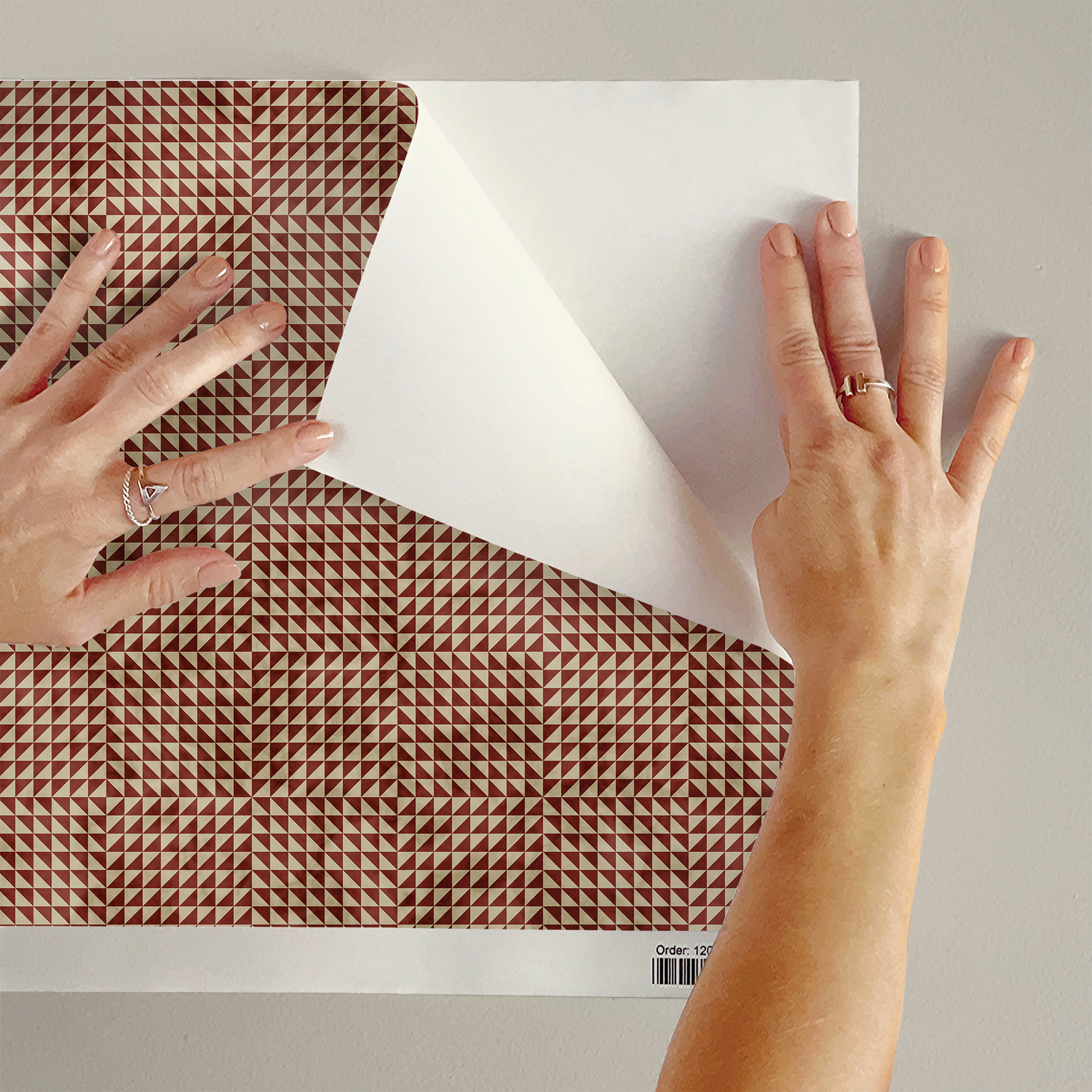 The artwork is a geometric composition featuring a symmetrical design dominated by diagonal stripes in shades of tan, rust and green. The central area is divided into four quadrants by two intersecting dark purple bands. Each quadrant contains diagonal stripes that create a chevron pattern, alternating between lavender and green hues. Vertical bands with circular motifs in black frame the central quadrants on the left and right sides. The outer edges are decorated with semicircular and triangular shapes, adding contrast with bold green and white patterns.The interplay of pastel colors and geometric forms gives the artwork a structured yet visually engaging appearance.