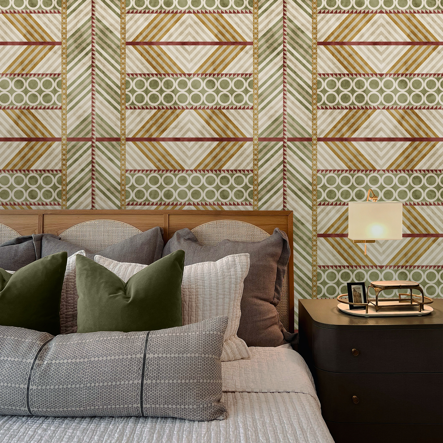 The artwork is a geometric composition featuring a symmetrical design dominated by diagonal stripes in shades of tan, rust and green. The central area is divided into four quadrants by two intersecting dark purple bands. Each quadrant contains diagonal stripes that create a chevron pattern, alternating between lavender and green hues. Vertical bands with circular motifs in black frame the central quadrants on the left and right sides. The outer edges are decorated with semicircular and triangular shapes, adding contrast with bold green and white patterns.The interplay of pastel colors and geometric forms gives the artwork a structured yet visually engaging appearance..