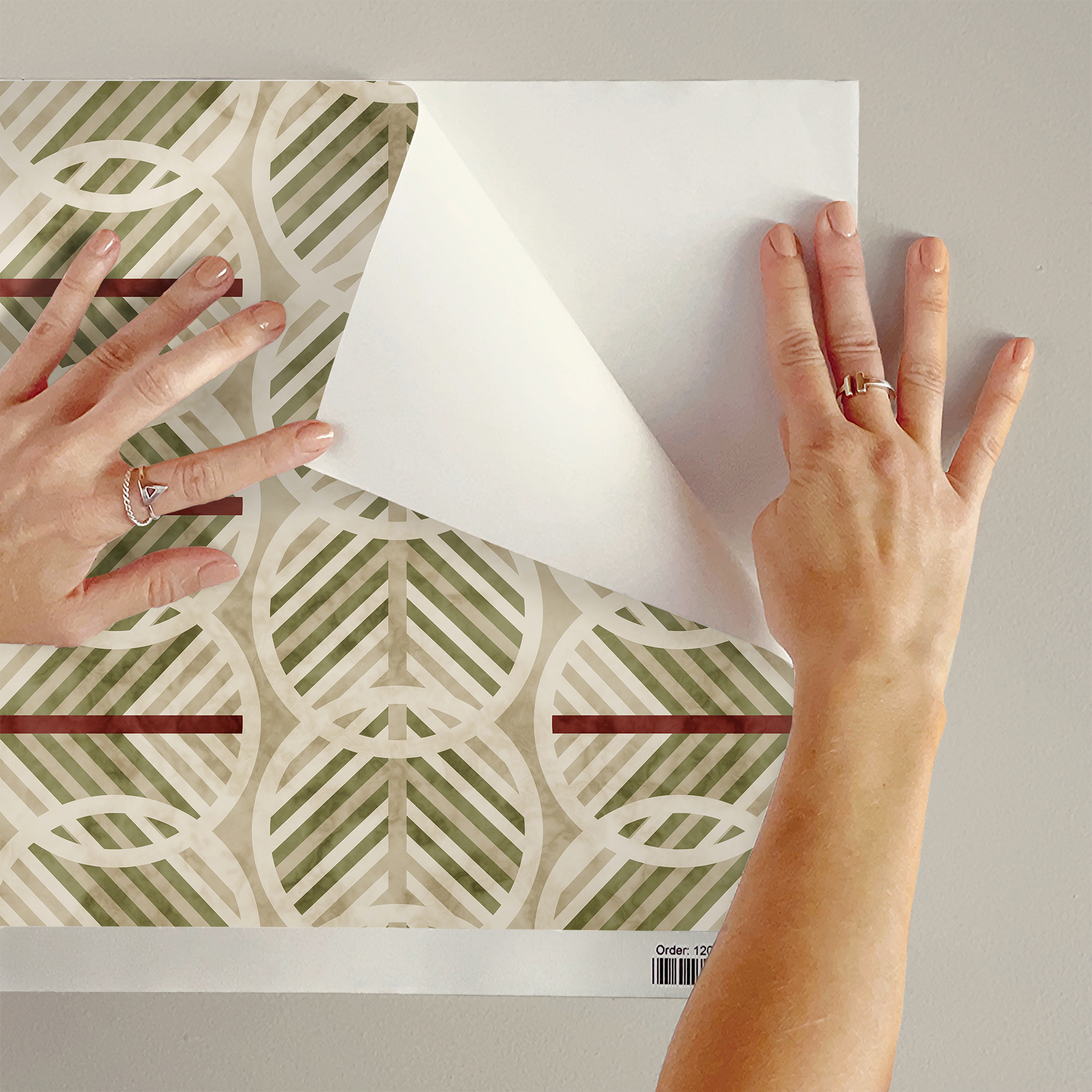 The artwork is a geometric composition featuring a symmetrical design dominated by diagonal stripes in shades of tan, rust and green. The central area is divided into four quadrants by two intersecting dark purple bands. Each quadrant contains diagonal stripes that create a chevron pattern, alternating between lavender and green hues. Vertical bands with circular motifs in black frame the central quadrants on the left and right sides. The outer edges are decorated with semicircular and triangular shapes, adding contrast with bold green and white patterns.The interplay of pastel colors and geometric forms gives the artwork a structured yet visually engaging appearance.