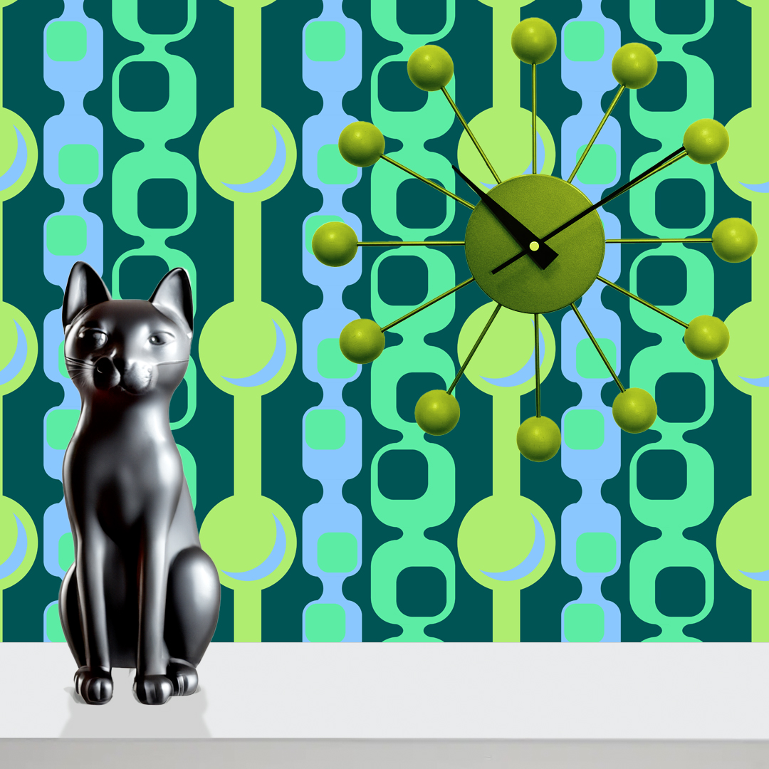 The artwork features a repeating geometric pattern of symmetrical shapes resembling elongated, curved diamonds or petals in various shades of blue and green. Each shape is split vertically with one half filled with a light blue and the other half filled with green or darker blue. The background is a light, almost pastel blue, which provides a soft yet vibrant backdrop. One of the blue shapes near the upper left contains a white starburst element, adding a focal point of brightness to the composition. The overall design conveys a modern, mid-century aesthetic with clean lines and harmonious color contrasts.